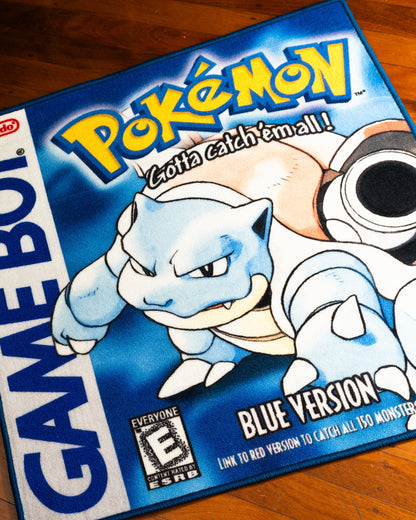 Pokemon Blue box art rug shown for scale in a room
