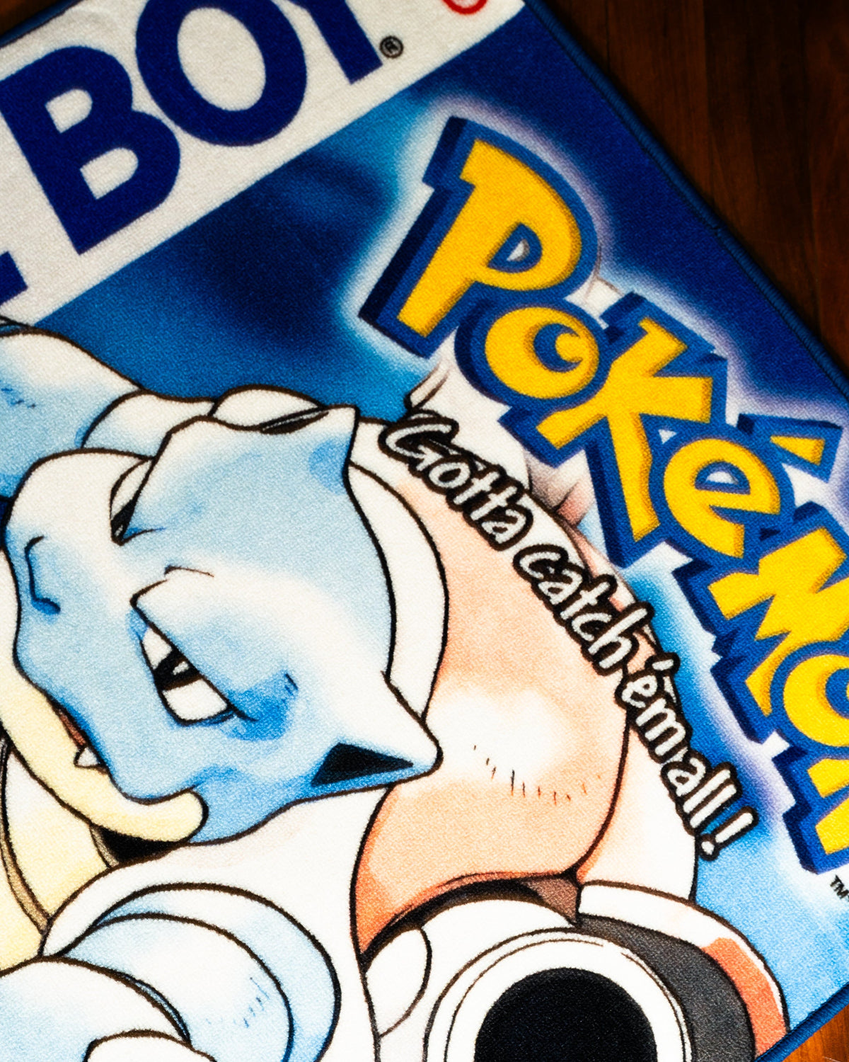 Pokemon Blue box art rug in a bedroom