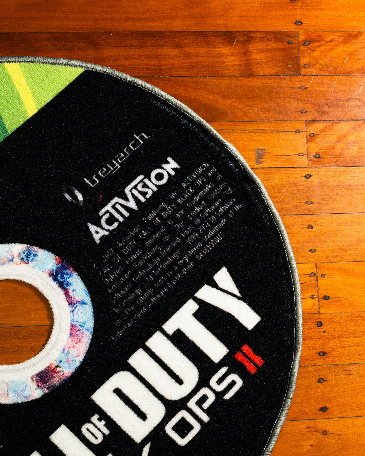 Black Ops II disc rug shown for scale in a room