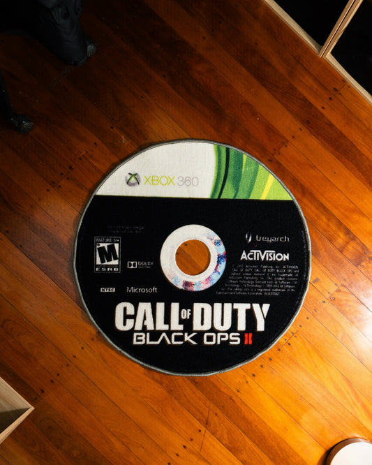 Black Ops II disc rug laid out on a floor