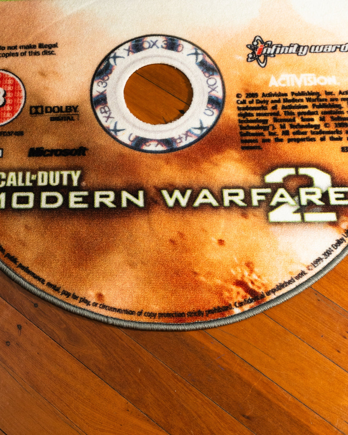 Modern Warfare 2 disc rug shown for scale in a room