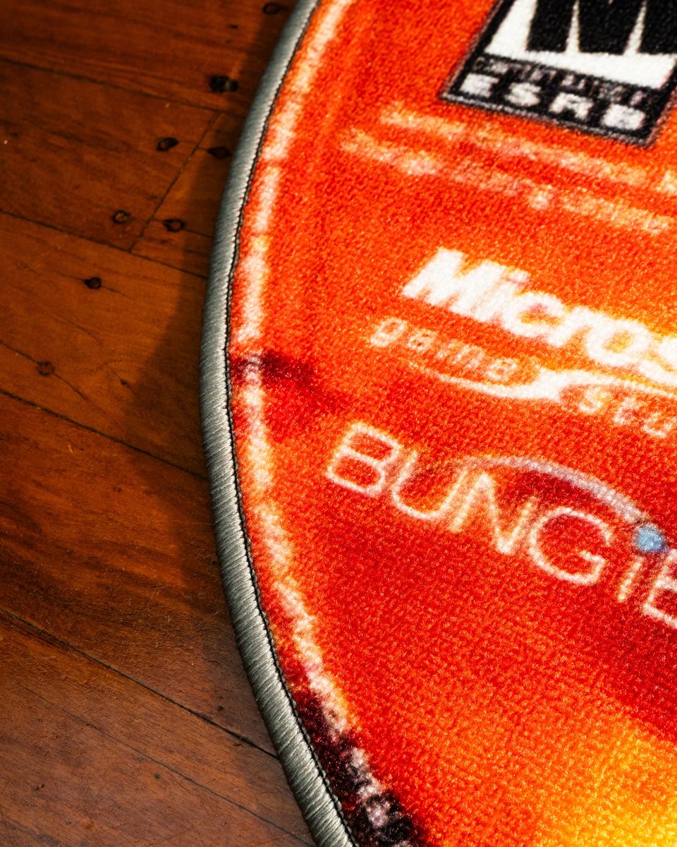 Halo 2 disc rug in a gaming setup