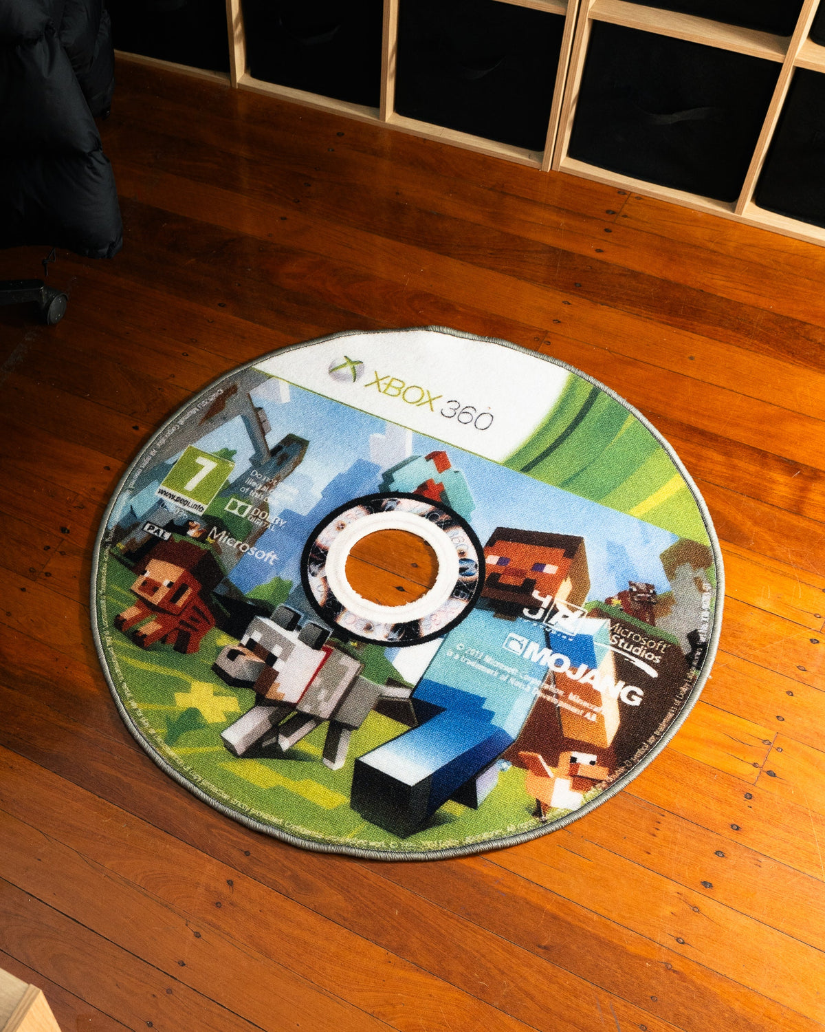 Minecraft Xbox 360 disc rug shown for scale in a room