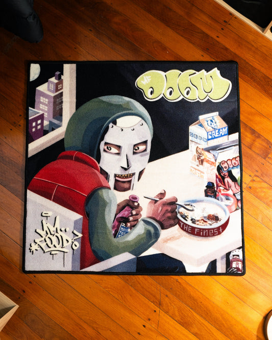 MF DOOM MM FOOD album rug laid out on a floor