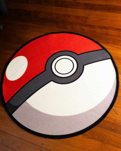 Poke Ball round rug shown for scale in a room
