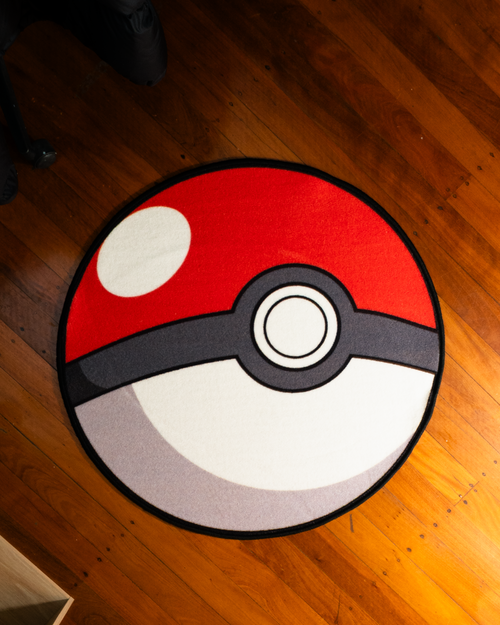 Poke Ball round rug laid out on a floor