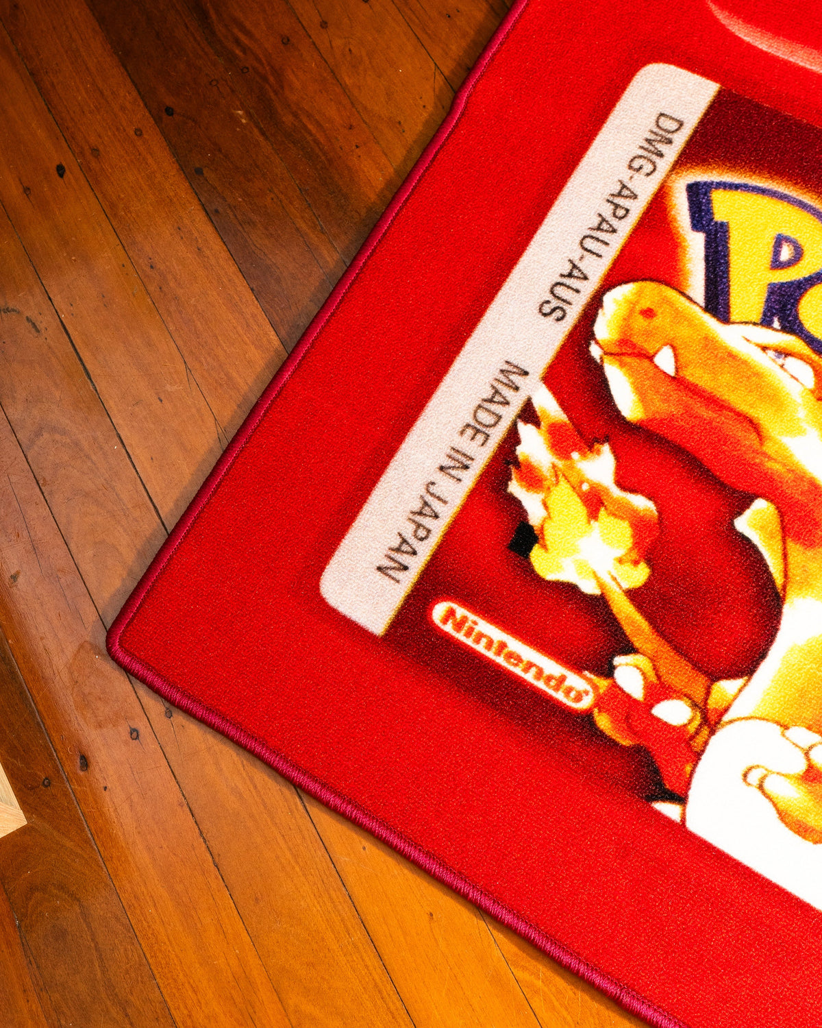 Pokemon Red cartridge cut-out rug full view showing the shaped edge