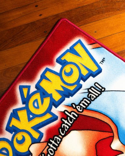 Pokemon Red box art rug shown for scale in a room