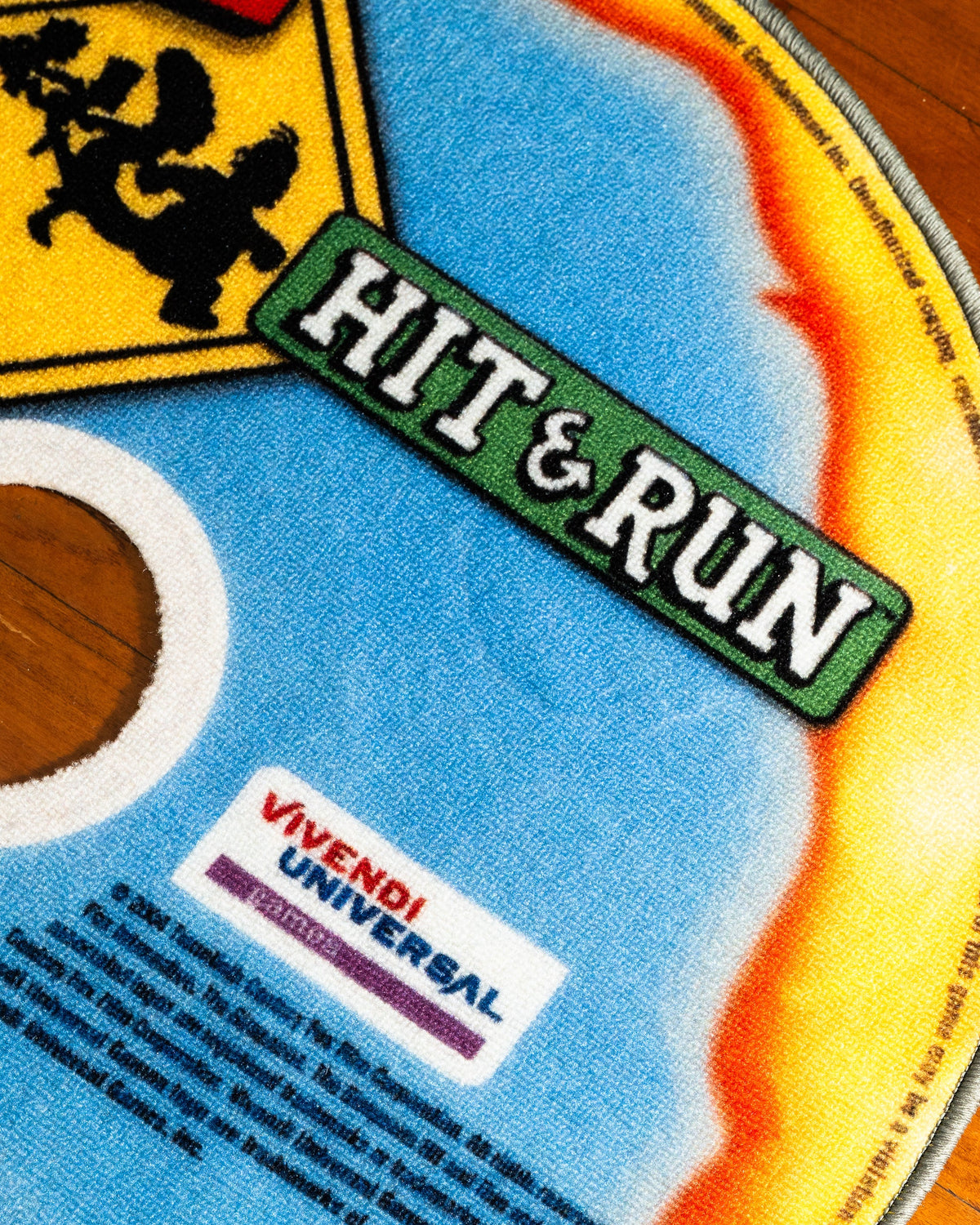 Hit and Run disc rug in a gaming setup