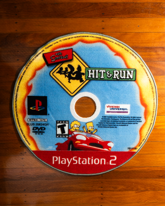Hit and Run disc rug laid out on a floor
