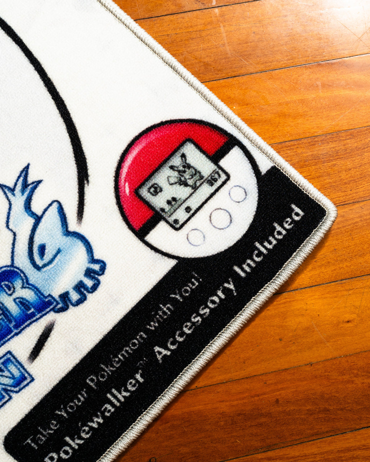 Pokemon SoulSilver box art rug in a bedroom