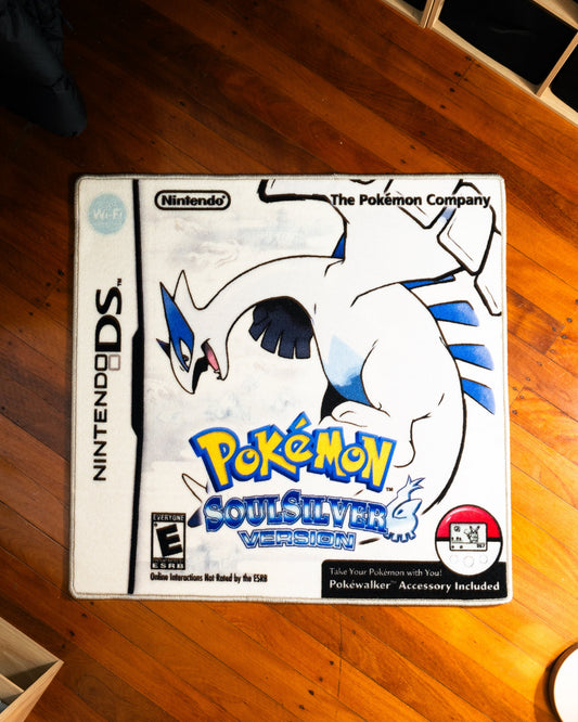 Pokemon SoulSilver box art rug laid out on a floor