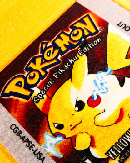 Pokemon Yellow cartridge cut-out rug in a bedroom